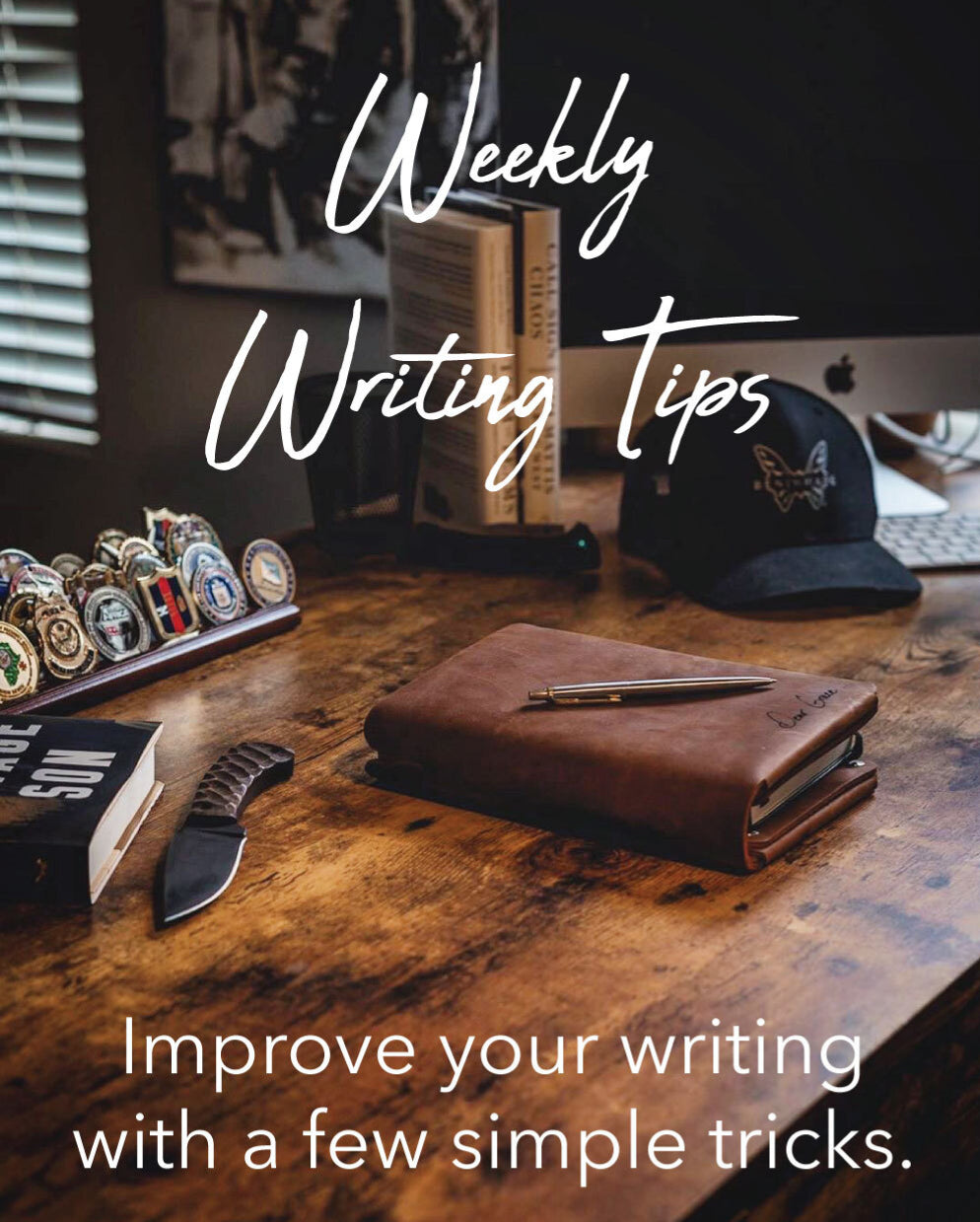 Weekly Writing Tips - Improve your writing with a few simple tricks. Pictured: Leather folio on desk with knife, bench made hat, medals, computer.