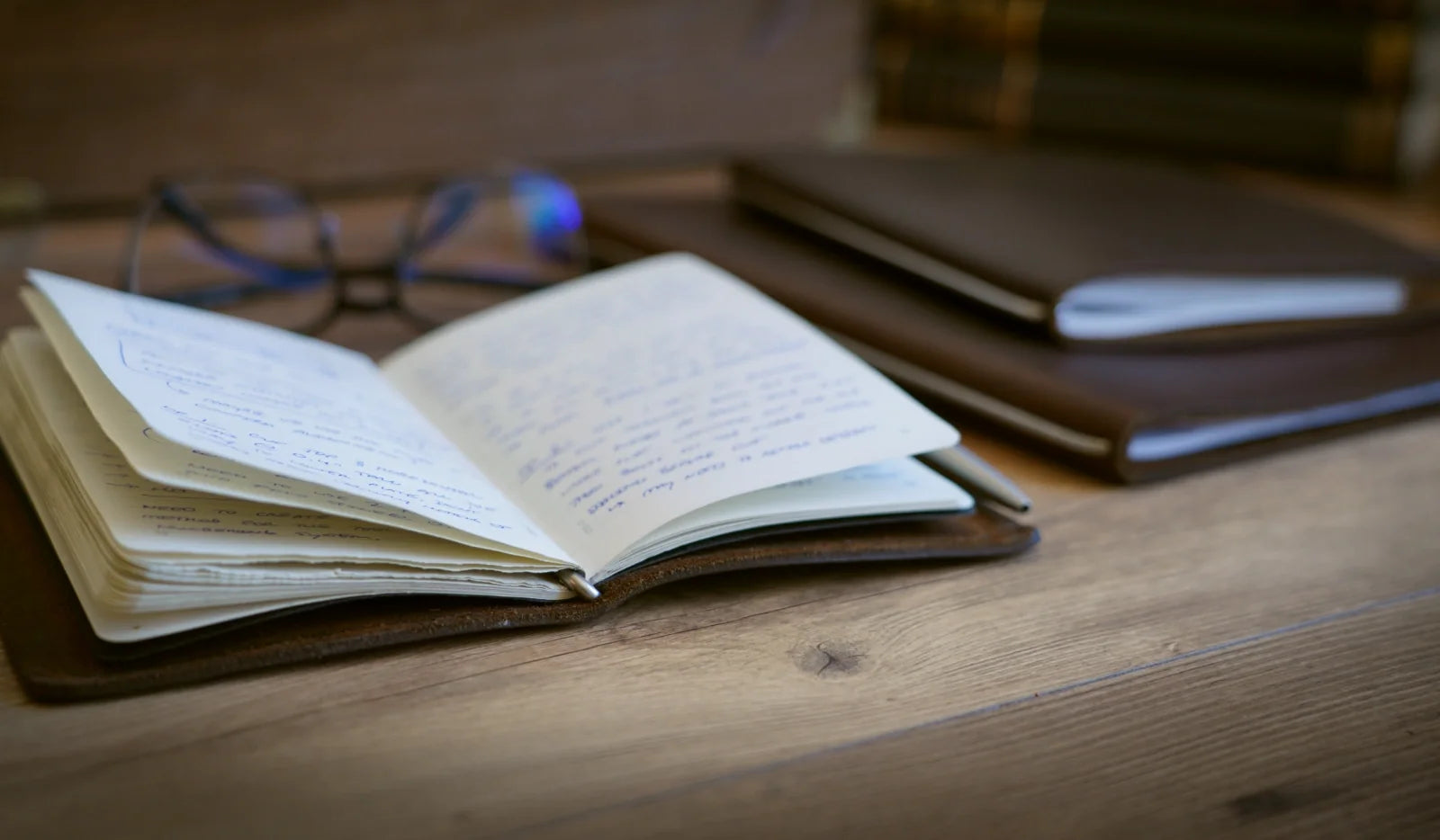 Mini Cut Refillable Leather Journal in Brown Americano Leather on Desk